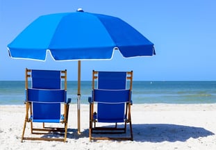chairs on the beach overlooking the gulf of mexico